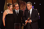 Love/Hate wins Best Drama sponsored by the BAI. Accepted by Suzanne McAuley (left), Steve Matthews (centre) and James Flynn (right, holding the statuette)
 