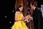 Actress Sarah Greene being presented with the Rising Star IFTA Award by actor Ciarán Hinds