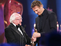 President Michael D. Higgins presents Liam Neeson with his award	