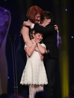 Emma Donoghue embraces her children Finn and Una