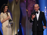 Ed Guiney accepts the award for Best Director on behalf of Lenny Abrahamson	